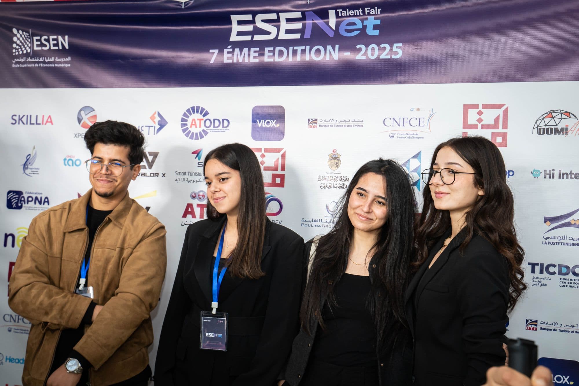Students in front of the 2025 partners wall — Synapse, 7th edition.